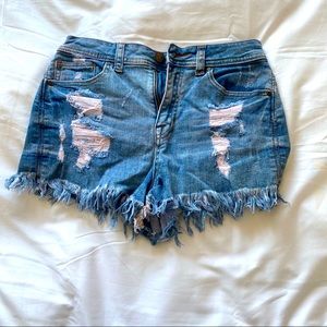 Sneak peek frayed ham booty shorts